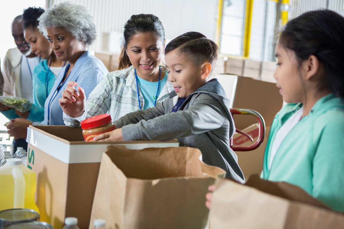 Food bank volunteers sort out food donations